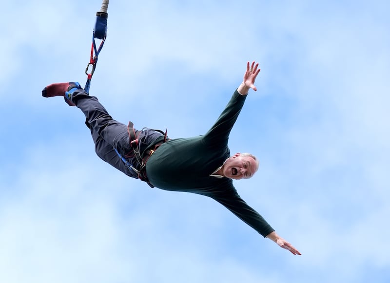 Liberal Democrat leader Sir Ed Davey taking part in a bungee jump during a visit to Eastbourne Borough Football Club