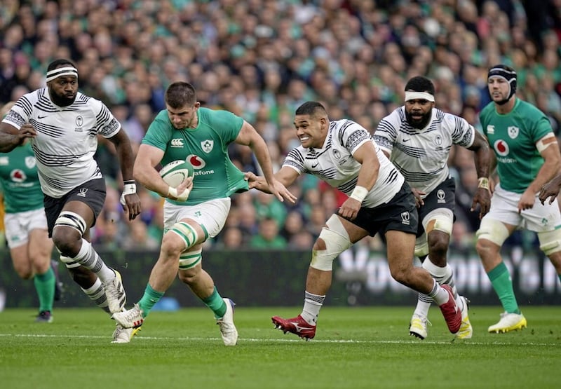 Ireland&#39;s Nick Timoney is pulled back by Fiji&#39;s Sam Matavesi (right) as he runs with the ball during the Autumn International match at the Aviva Stadium in Dublin, Ireland. Picture date: Saturday November 12, 2022. PA Photo. See PA story RUGBYU Ireland. Photo credit should read: Niall Carson/PA Wire. RESTRICTIONS: Use subject to restrictions. Editorial use only, no commercial use without prior consent from rights holder. 