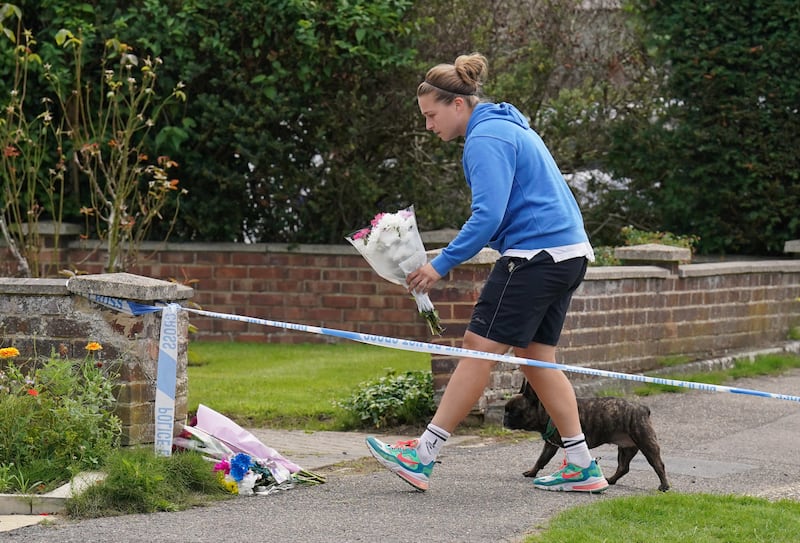 Floral tributes were left outside a property on Hammond Road, Woking, where Sara’s body was found