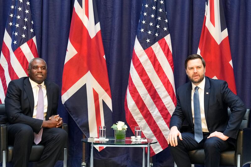 Foreign Secretary David Lammy, left, with US vice president JD Vance in Munich (Matthias Schrader/AP)