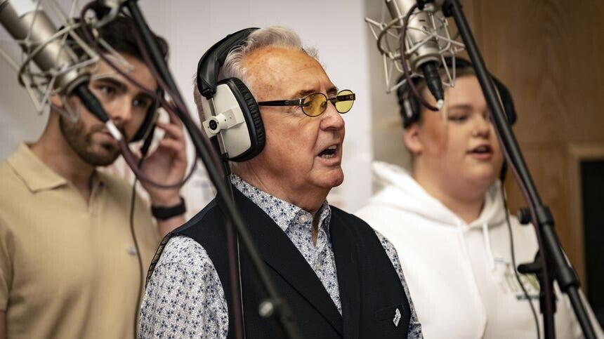 Tony Christie with dementia carers Graeme Sutherland and Katie Neal in the studio recording a version of Thank You For Being A Friend (John Dawson/PA)
