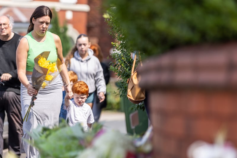 People added to the flora tributes throughout Tuesday