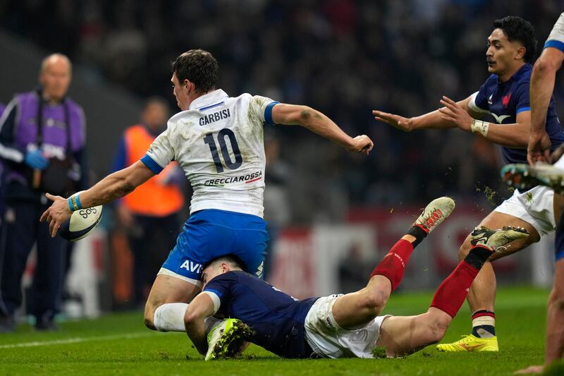 Paolo Garbisi reaches for the ball against France in Lille (Lewis Joly/AP)