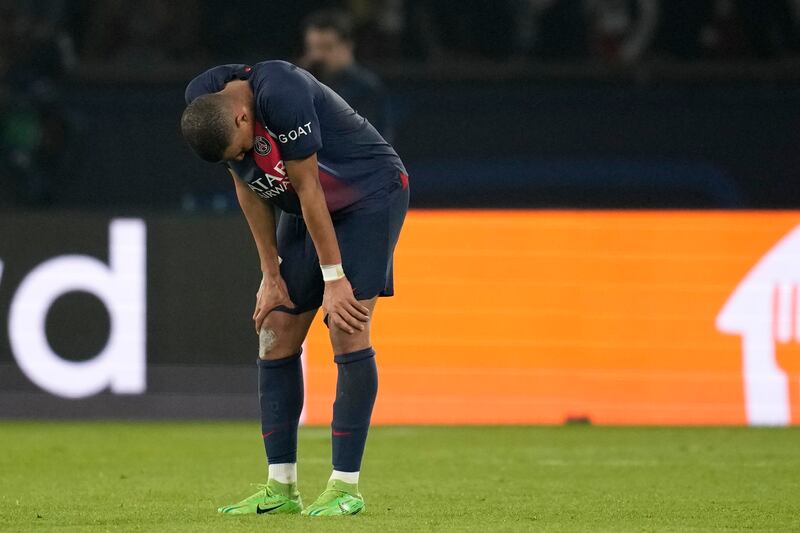 Mbappe cut a dejected figure after PSG were knocked out of the Champions League by Borussia Dortmund this week (Christophe Ena/AP)