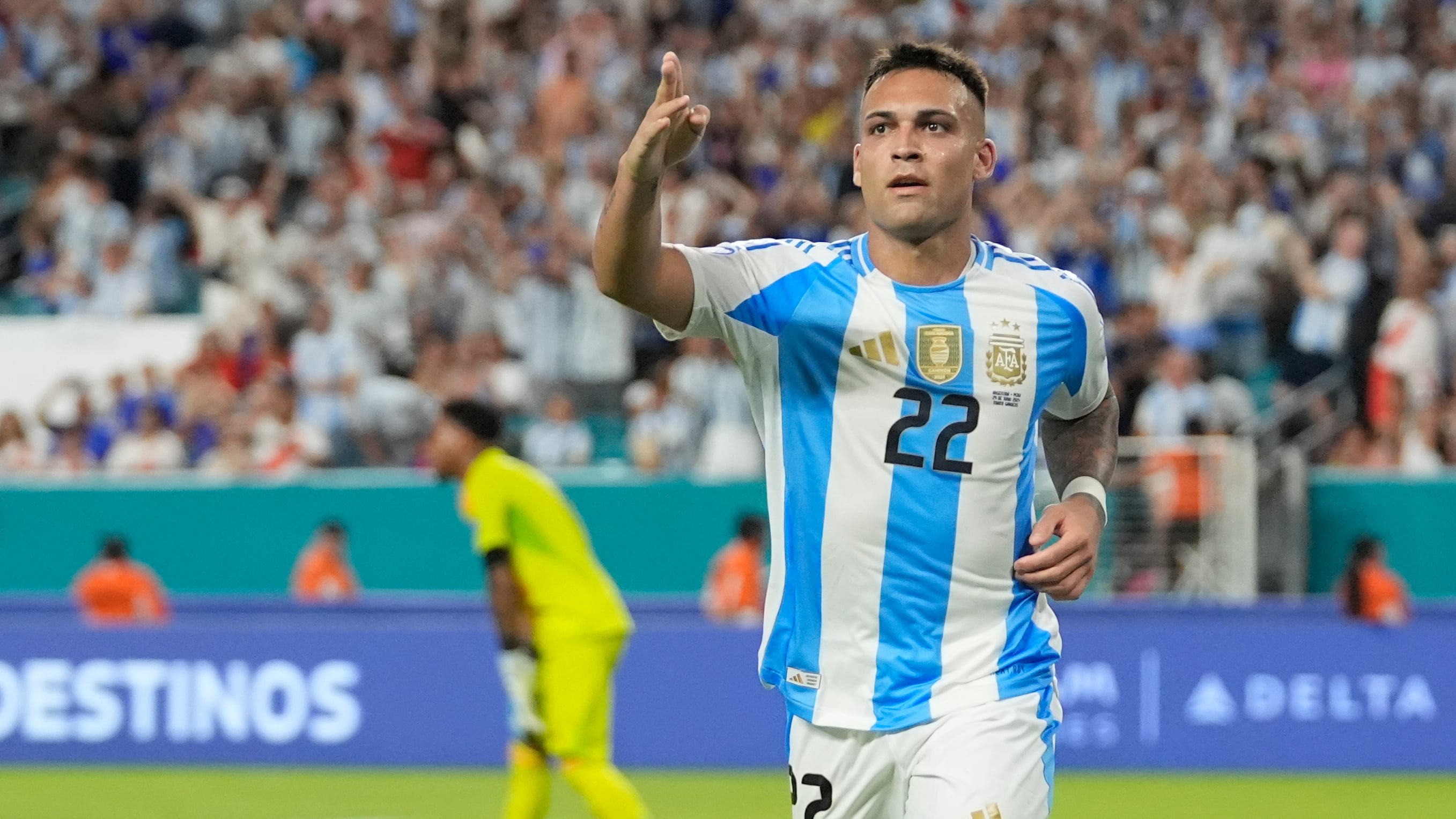 Argentina’s Lautaro Martínez (22) celebrates scoring his side’s second goal against Peru (Lynne Sladky/AP)