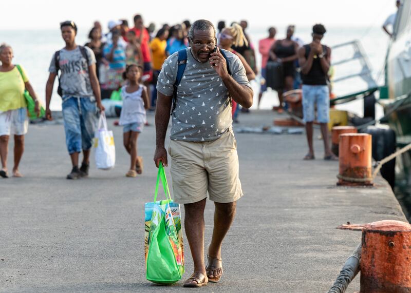 Residents of Union Island evacuated via ferry, arriving in Kingstown, St. Vincent and the Grenadines (Lucanus Ollivierre/AP)