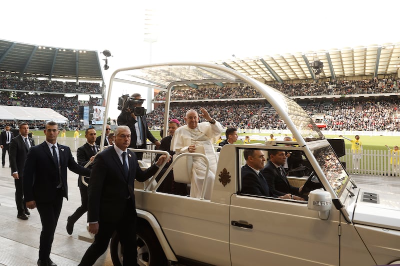 Francis waved to the crowd as he arrived to lead mass at the King Baudouin stadium in Brussels (Omar Havana)/AP)