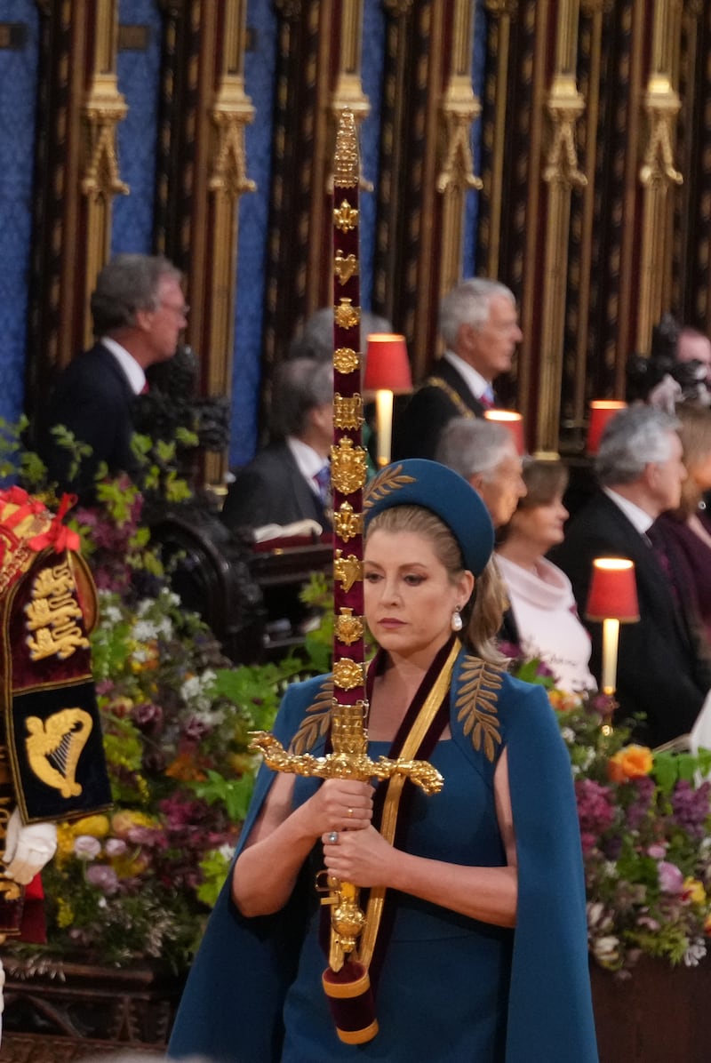 Lord President of the Council, Penny Mordaunt, carrying the Sword of State, in the procession during the coronation