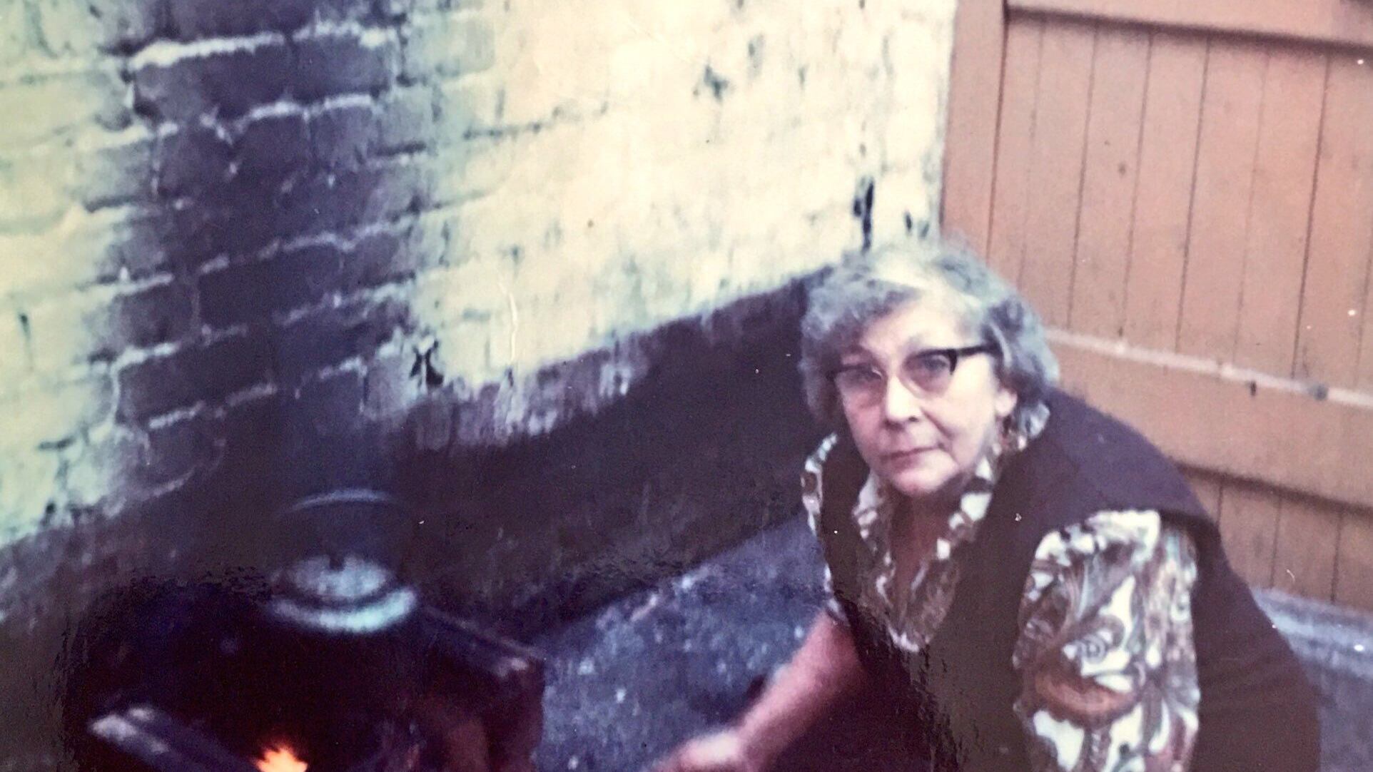 Martha Smyth (1912 to 1987) cooking a meal in the yard of her Ainsworth Drive home during the Ulster Workers' Council Strike of May 1974