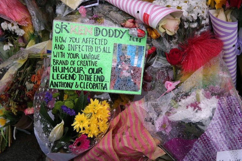 Floral tributes outside the home of Sir Ken Dodd in Knotty Ash (Aaron Chown/PA)