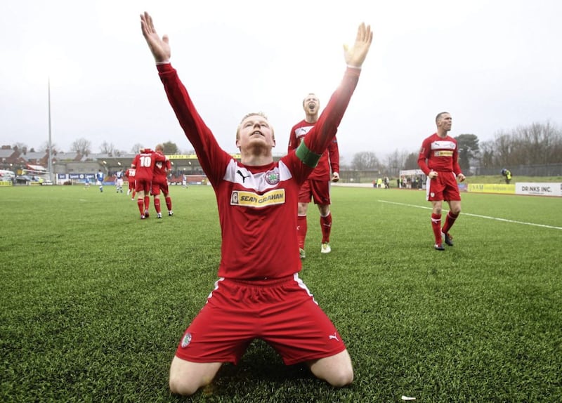 They were the days. Cliftonville skipper George McMullan celebrates after scoring from the spot against Linfield 