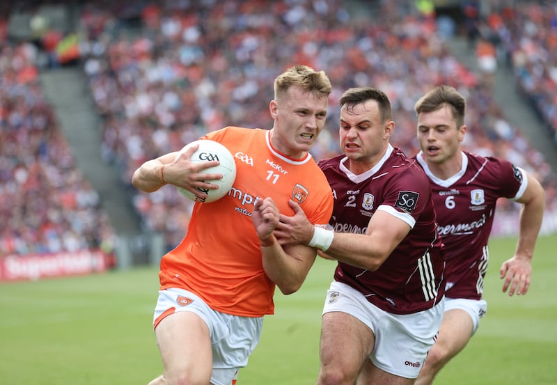 Armagh’s Rian O'Neill  and Galway’s Johnny McGrath  during Sunday’s All-Ireland SFC Final at Croke Park in Dublin. 
PICTURE COLM LENAGHAN