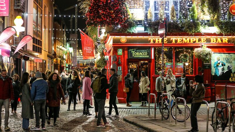 People out socialising in Temple Bar in Dublin city centre (PA)