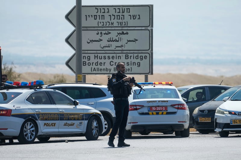 Israeli police stand guard near the Allenby Bridge crossing between the West Bank and Jordan after the deadly shooting (Mahmoud Illean/AP)