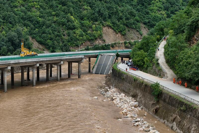 Rescuers work near a collapsed bridge in China (Zhao Yingbo/Xinhua via AP)