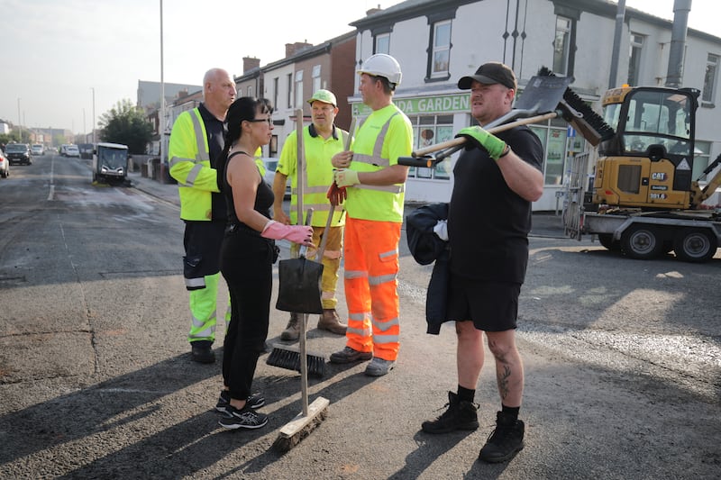 Response workers clear Sussex Road in Southport, Merseyside