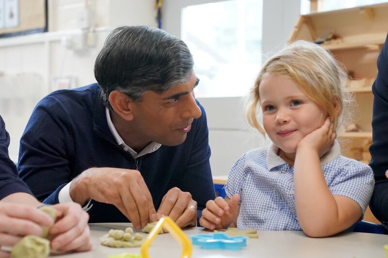 Prime Minister Rishi Sunak chatting to a pupil at Braishfield Primary School in Romsey, Hampshire
