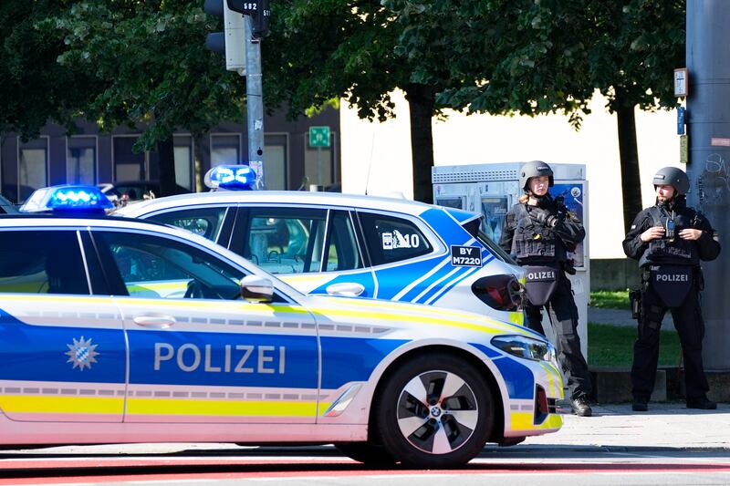 Police officers block a street after the incident in Munich (Matthias Schrader/AP)