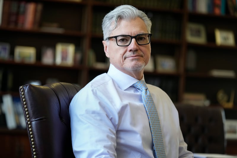 Judge Juan M Merchan poses in his chambers in New York (Seth Wenig/AP)