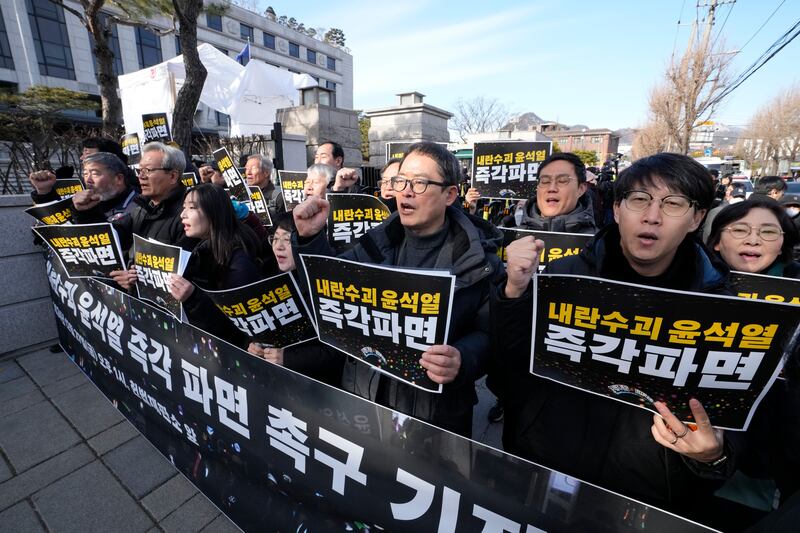 Protesters stage a rally demanding the arrest of impeached South Korean President Yoon Suk Yeol outside of the Constitutional Court in Seoul (AP/Ahn Young-joon)