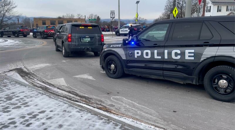 Police follow a hearse carrying fallen border patrol agent David Maland (WCAX via AP)