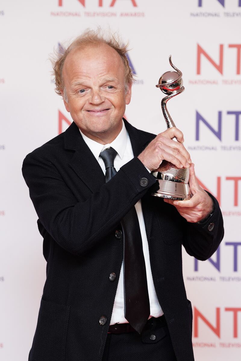 Toby Jones celebrating winning an award at the National Television Awards