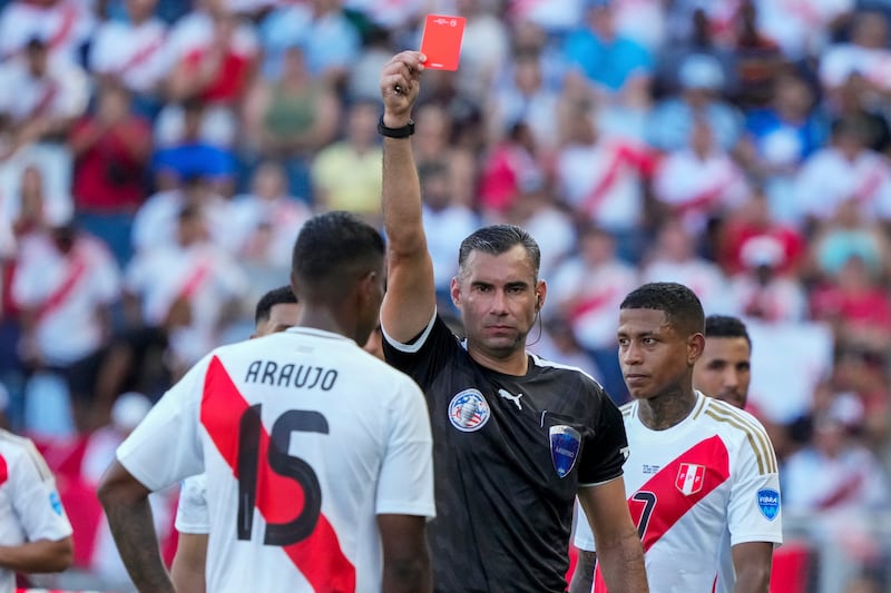 The sending off of Peru’s Miguel Araujo changed the nature of the game (Ed Zurga/AP)