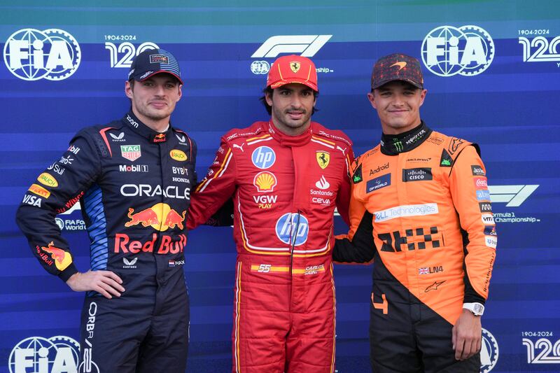 Sainz (centre) beat Verstappen and Norris to pole (AP Photo/Fernando Llano)