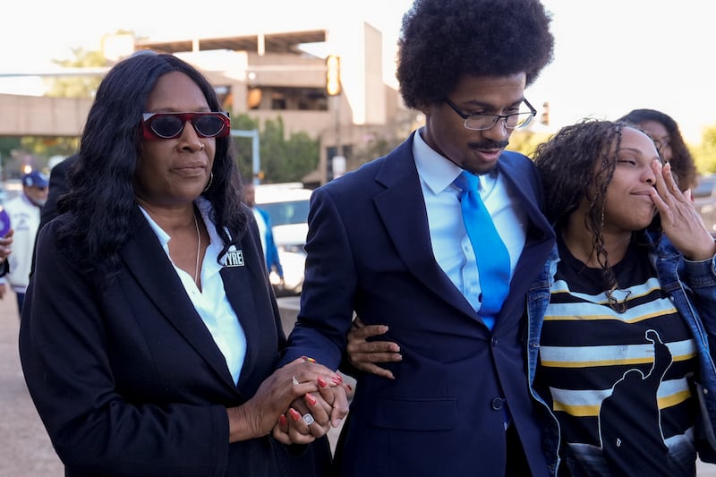 RowVaughn Wells, left, mother of Tyre Nichols, prays with Representative Justin J Pearson at the federal courthouse in Memphis (George Walker IV/AP)