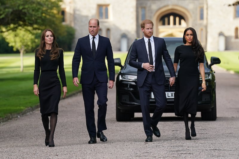 The Princess of Wales, the Prince of Wales and the Duke of Sussex, then 37, and the Duchess of Sussex walk to meet members of the public at Windsor Castle following the death of Queen Elizabeth II in 2022