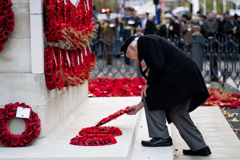 D-Day veteran Mervyn Kersh, 99, lays a wreath during the annual parade by AJEX, the Jewish Military Association