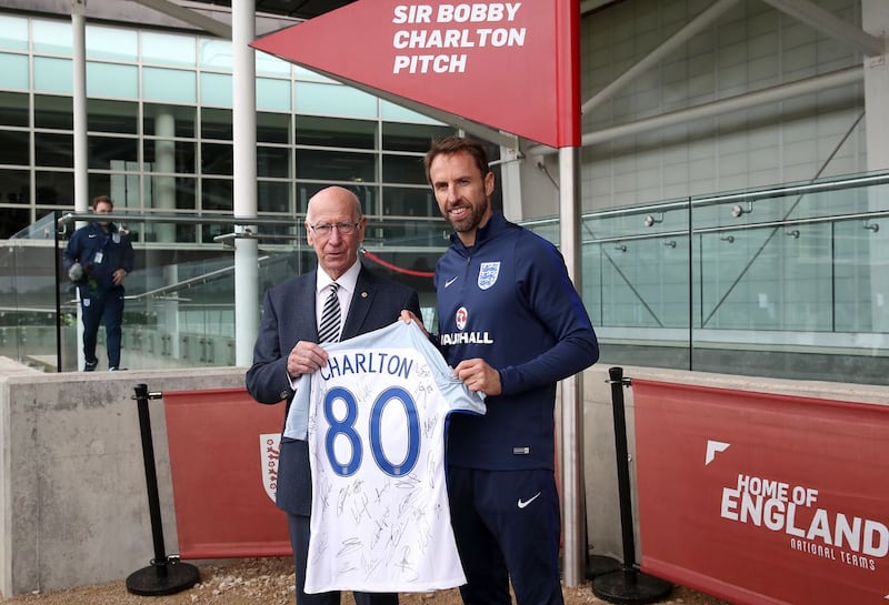 Sir Bobby Charlton, left, was presented with an England shirt to mark his 80th birthday in 2017 by current manager Gareth Southgate