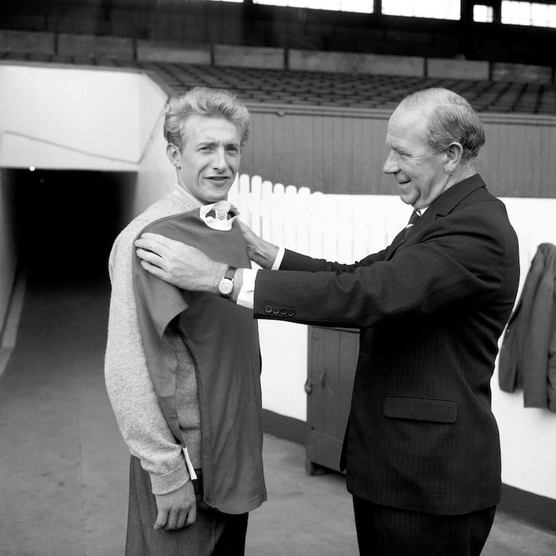 Law with Manchester United manager Matt Busby after joining the club from Torino