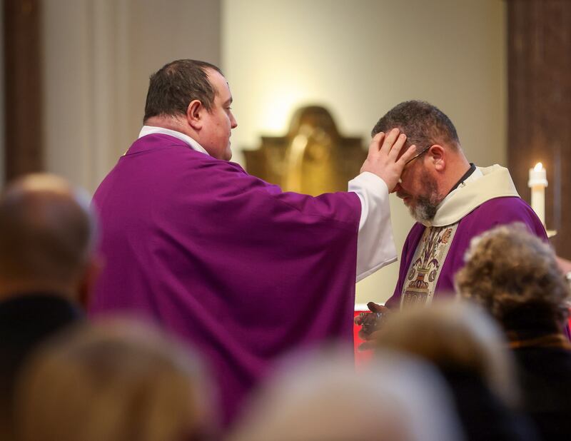 Parishioners young and old receive their ashes from Fr Tony and Fr Eugene at St Patricks Church in Donegall Street, Belfast marking the beginning of Lent