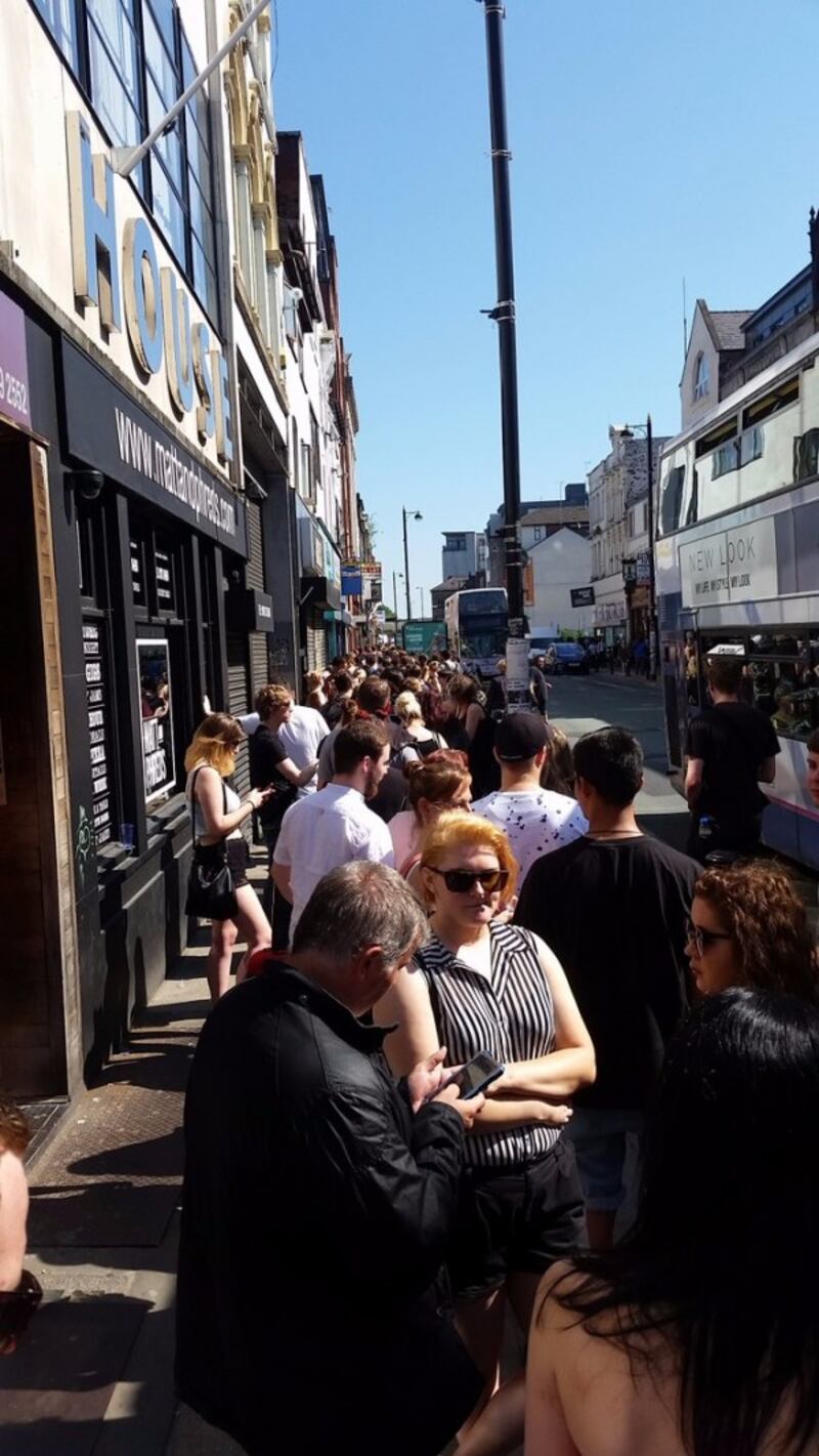 people queue to get a tattoo (Dan Morehead/PA)