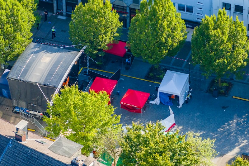 Emergency services tents in front of the stage in Solingen city centre after three people were killed and eight others injured in a knife attack at a festival (Christoph Reichwein/dpa/AP)