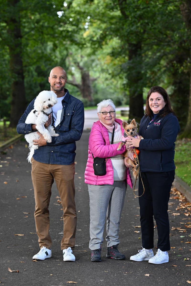 Rosie’s Trust ambassador, and Q Radio presenter, Ibe Sesay, with his dog, Barney; Janet Harris and Rilla, who are supported by the local charity; and Operations Manager, Jayne McStay.