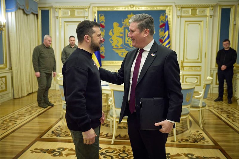 Handout photo issued by the Office of the President of Ukraine of Volodymyr Zelensky welcoming Sir Keir Starmer to Kyiv in February