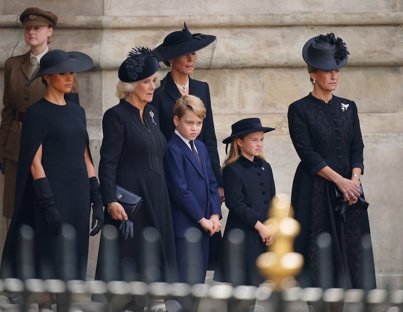 The Duchess of Sussex, the Queen, the Princess of Wales, Prince George, Princess Charlotte and the then-Countess of Wessex at the late Queen’s funeral