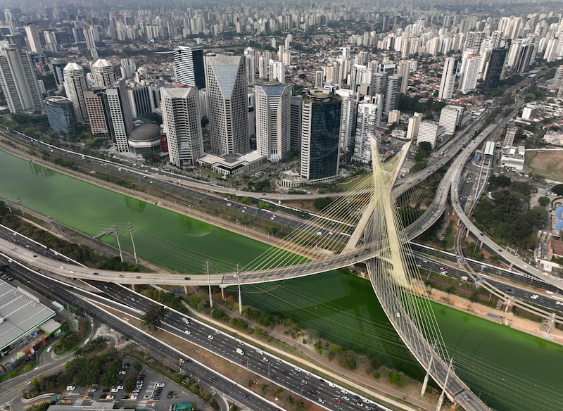 The river has turned green (Andre Penner/AP)