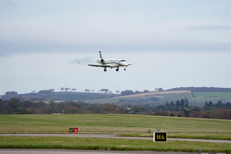 The plane landed just before 2pm on Friday