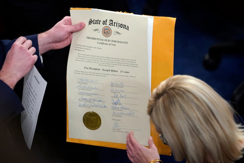 The certification of Electoral College votes for the state of Arizona is unsealed (Andrew Harnik/AP)