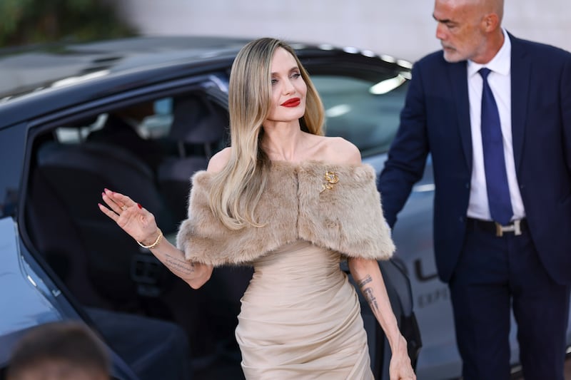 Angelina Jolie poses for photographers upon arrival for the premiere of the film Maria during the 81st edition of the Venice Film Festival in Venice (Vianney Le Caer/Invision/AP)