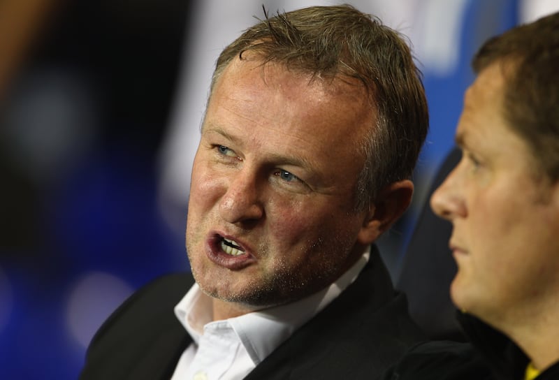 LONDON, ENGLAND - SEPTEMBER 29:  Michael O'Neill manager of Shamrock Rovers talks to assistant manager Jim Magilton (R) prior to the UEFA Europa League Group A match between Tottenham Hotspur and Shamrock Rovers at White Hart Lane on September 29, 2011 in London, England.  (Photo by Julian Finney/Getty Images)