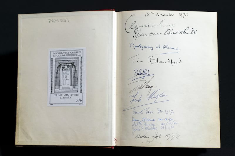 The signatures of the Churchill family are seen in one of three Downing Street Visitors Books at the National Archives