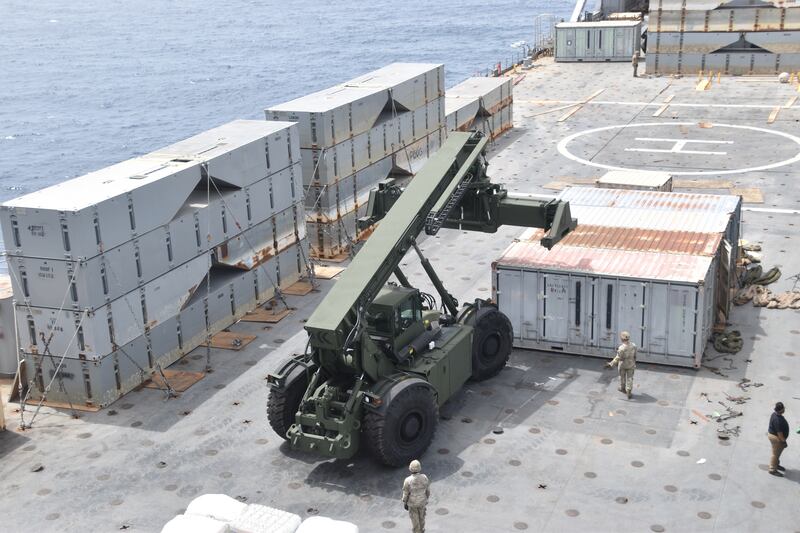 Soldiers assigned to the 7th Transportation Brigade (Expeditionary) and sailors attached to the MV Roy P Benavidez assemble the roll-on, roll-off distribution facility, or floating pier, off the shore of Gaza (US Army via AP)