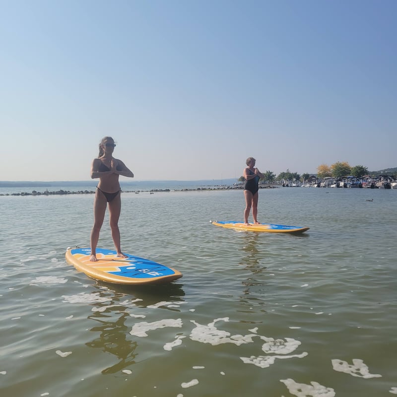 Hannah (right) and Grace on an SUP yoga class