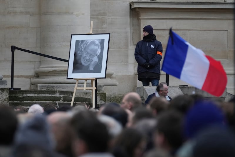 A portrait of late far-right leader Jean-Marie Le Pen outside Notre Dame du Val-de-Grace church during a public memorial for him on Thursday (Thibault Camus/AP)