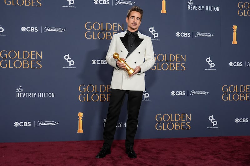 Colin Farrell poses in the press room with the award for best performance by a male actor in a limited series, anthology series, or a motion picture made for television (Chris Pizzello/AP)