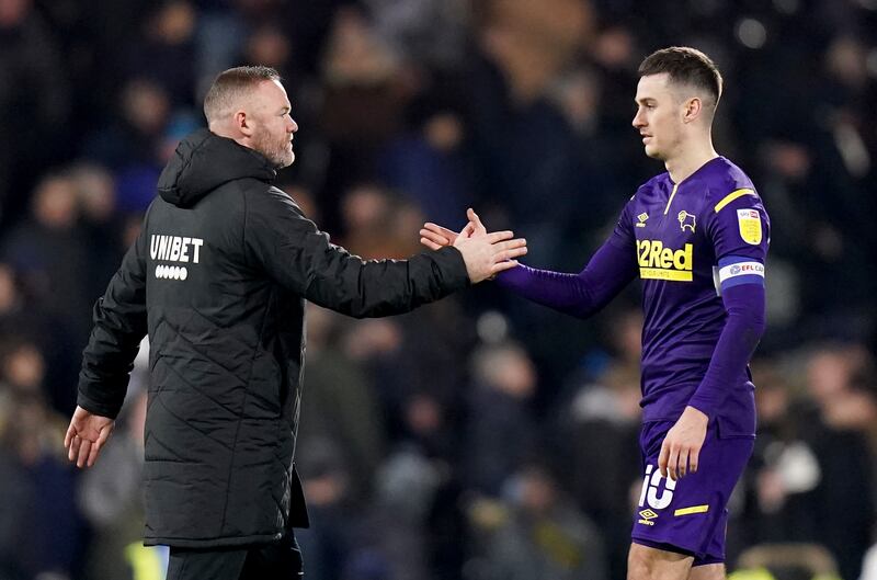 Tom Lawrence’s former Derby manager Wayne Rooney (left) had claimed the player was overlooked by Wales because of a “bit of history” with the former manager Rob Page